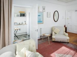 a living room with a couch and two chairs at Sheen's House in Edinburgh