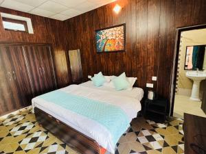 En eller flere senge i et værelse på Lansdowne Hill View Cottages, Shantiraj