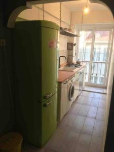 a green refrigerator in a kitchen with a window at İstanbul Kadiköy Harbour-, Cozy place, Feel@Home in Istanbul