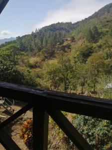 a view from the balcony of a mountain at Coffee Store La Cabaña in Valle Hornito