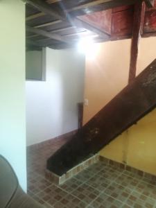 an empty room with a staircase in a building at Coffee Store La Cabaña in Valle Hornito