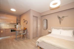 Ένα ή περισσότερα κρεβάτια σε δωμάτιο στο New Town Apartments