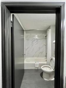 A bathroom at Super 8 by Wyndham Sealy