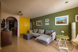 a living room with a couch and a table at Casa Zora in Agaete