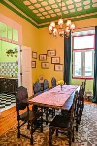 a dining room with a table and chairs at Vintage Balcony Guesthouse & Suites in Ovar +78 photos
