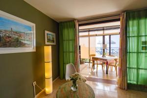 a living room with a table and a dining room at Casa Zora in Agaete