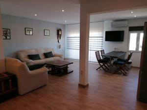 a living room with a couch and a table at Las Vistas in Buendía