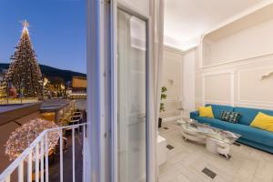 a living room with a christmas tree and a couch at YourHome - Royal Blue Suite in Sorrento