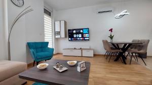 TV a/nebo společenská místnost v ubytování Tirkiz