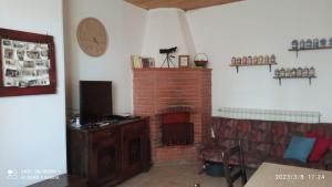 A television and/or entertainment centre at Etna, salvia e rosmarino