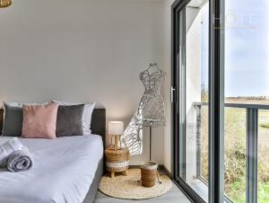 Posteľ alebo postele v izbe v ubytovaní La Chaumoise : Villa neuve avec vue exceptionnelle