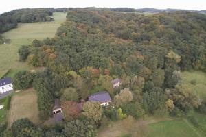 an overhead view of a house in a forest of trees at Haus im Hanfbachtal 