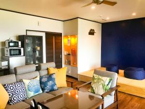a living room with a couch and a bed at Niruyakanaya BISE - Vacation STAY 97194v in Bise