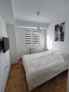 Postel nebo postele na pokoji v ubytování Bianco Rosso Apartment