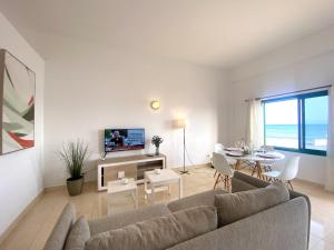 Et tv og/eller underholdning på Apartamento 11. Arena y mar