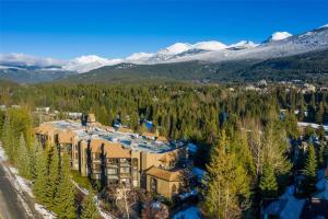 an aerial view of a resort with snow covered mountains at Ironwoods on Blueberry Hill by Whistler Blackcomb Vacation Rentals in Whistler