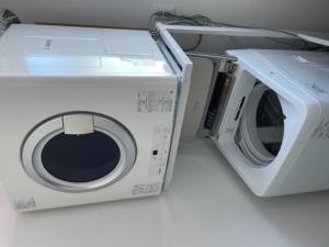 a white washing machine sitting on top of a counter at Minshuku Cress - Vacation STAY 48561v in Biei