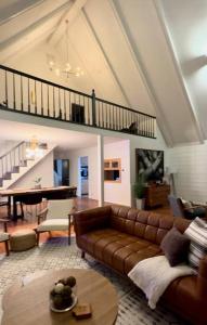 a living room with a couch and a table at A Cozy Retreat in Gainesville