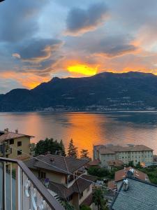 a view of a sunset over a large body of water at ORO, 8 in Bellano