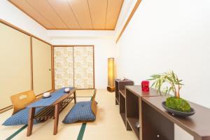 an office with a desk and chairs and a table at Mansion Kitanomachi Room 408 - Vacation STAY 64438v in Awaji