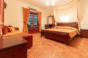 Ліжко або ліжка в номері Pelagos Hotel
