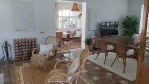 A television and/or entertainment centre at LUXURY STYLE VILLA AURORA Roche