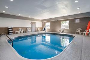 a large swimming pool in a hotel room at Comfort Inn Indianapolis Airport in Plainfield