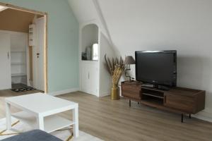 Μια τηλεόραση ή/και κέντρο ψυχαγωγίας στο Appartement pratique et cosy