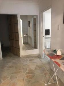 a room with a room with a mirror and a table at Apartamento en el centro de Pitalito in Pitalito