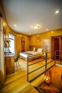 a hotel room with a bed and a balcony at Chakana Hotel Boutique Centro in Quito