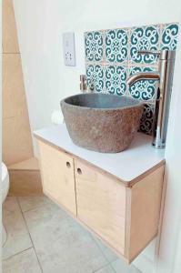 a bathroom with a bowl sink on a counter at The View, Kingsand, luxurious seafront penthouse apartment with sun trap balcony and incredible sea views in Kingsand