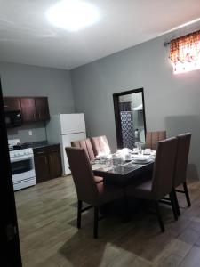 a dining room table and chairs in a kitchen at Casa Gracia in Jamay