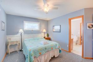 a bedroom with a bed and a ceiling fan at Gray Haven #11-DE in Avon
