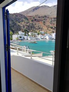 a view of a harbor from a room with a window at Maistrali in Loutro