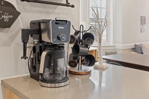 a coffee maker sitting on top of a counter at Loopin Around Atlantic City Luxe 5BR Townhouse in Orange Loop in Atlantic City