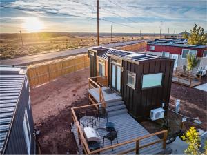 a tiny house being built on a roof at Cozy modern tiny home near ZION & private deck in Apple Valley