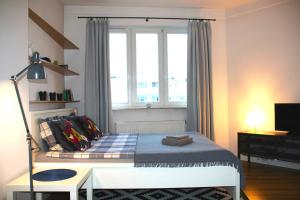 Posteľ alebo postele v izbe v ubytovaní Apartament blisko Centrum