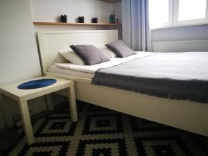 Posteľ alebo postele v izbe v ubytovaní Apartament blisko Centrum
