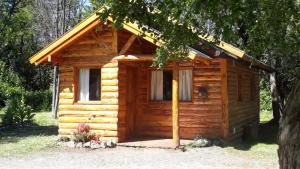 a log cabin with a porch at Cabañas Shalom in Lago Puelo