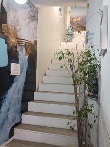 a set of stairs with a painting on the wall at Alfonso XII in Redondela