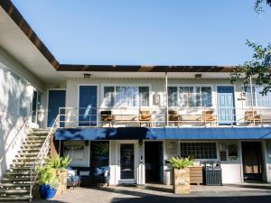 a house with a blue roof and stairs at Golden Haven Hot Springs in Calistoga