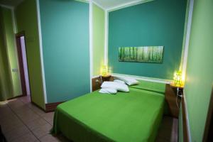 Postel nebo postele na pokoji v ubytování Hotel Pontenuovo