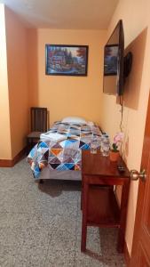 Tempat tidur dalam kamar di Hotel Maya America