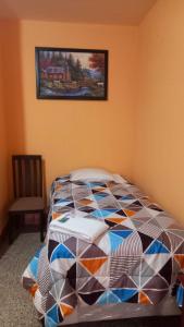 Ein Bett oder Betten in einem Zimmer der Unterkunft Hotel Maya America
