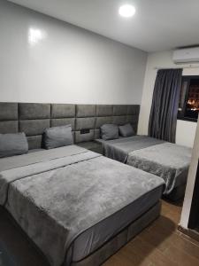 Postel nebo postele na pokoji v ubytování Hôtel Saâda