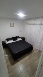 Een bed of bedden in een kamer bij Hermoso Apartamento en Circasia, Quindío.