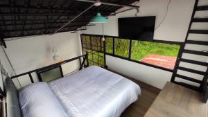 Voodi või voodid majutusasutuse INLOFT Quindío toas