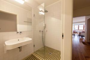 a bathroom with a sink and a shower at Citybreak-apartments Douro View in Porto