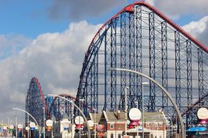 a roller coaster at a theme park on a cloudy day at Sandpiper Holiday Apartments in Blackpool