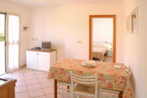 a kitchen and dining room with a table and chairs at Apartment in Capoliveri near Sea Beach in Capoliveri